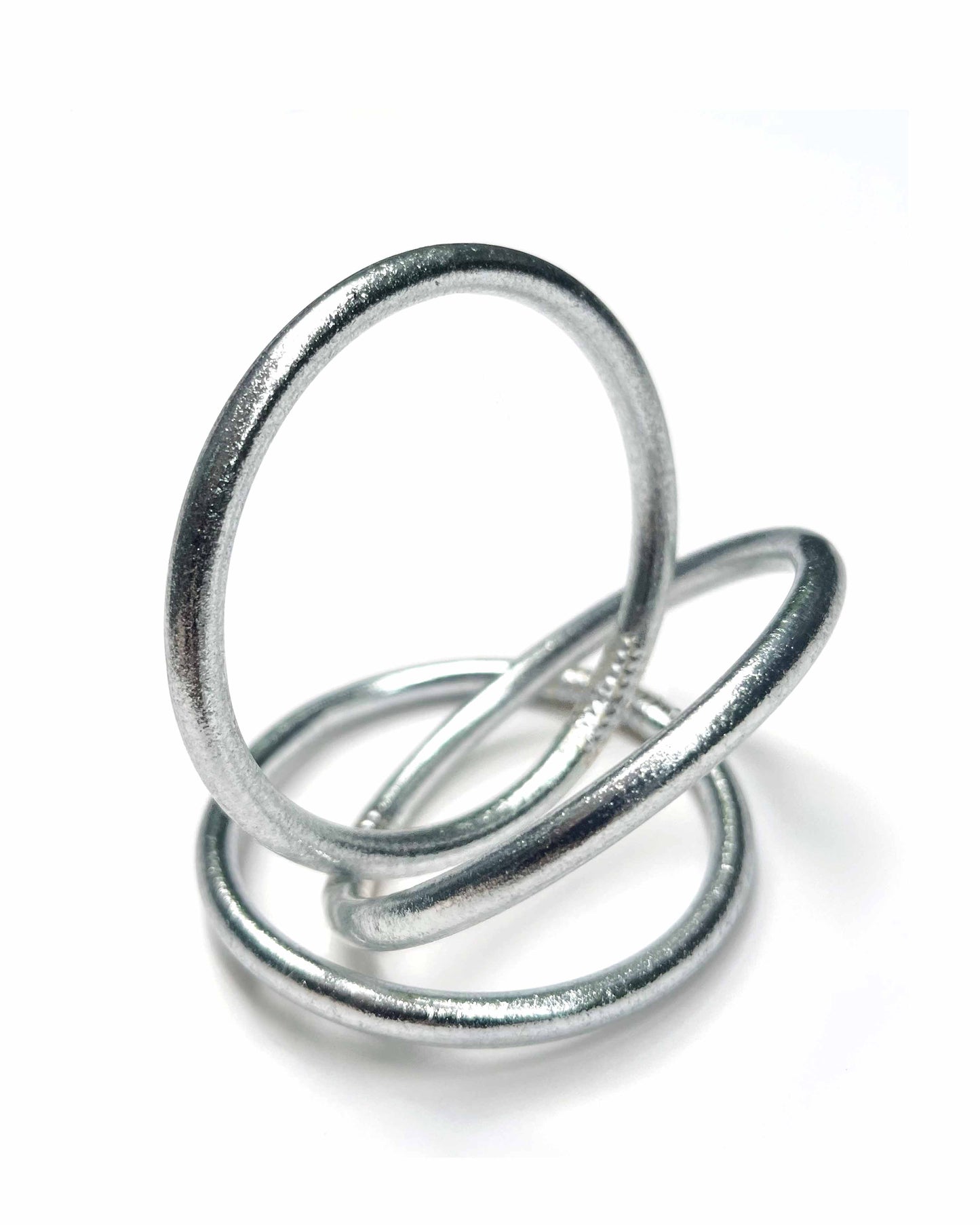 Chunky Kumlai Buddhist bangles in Classic Silver on a white background.