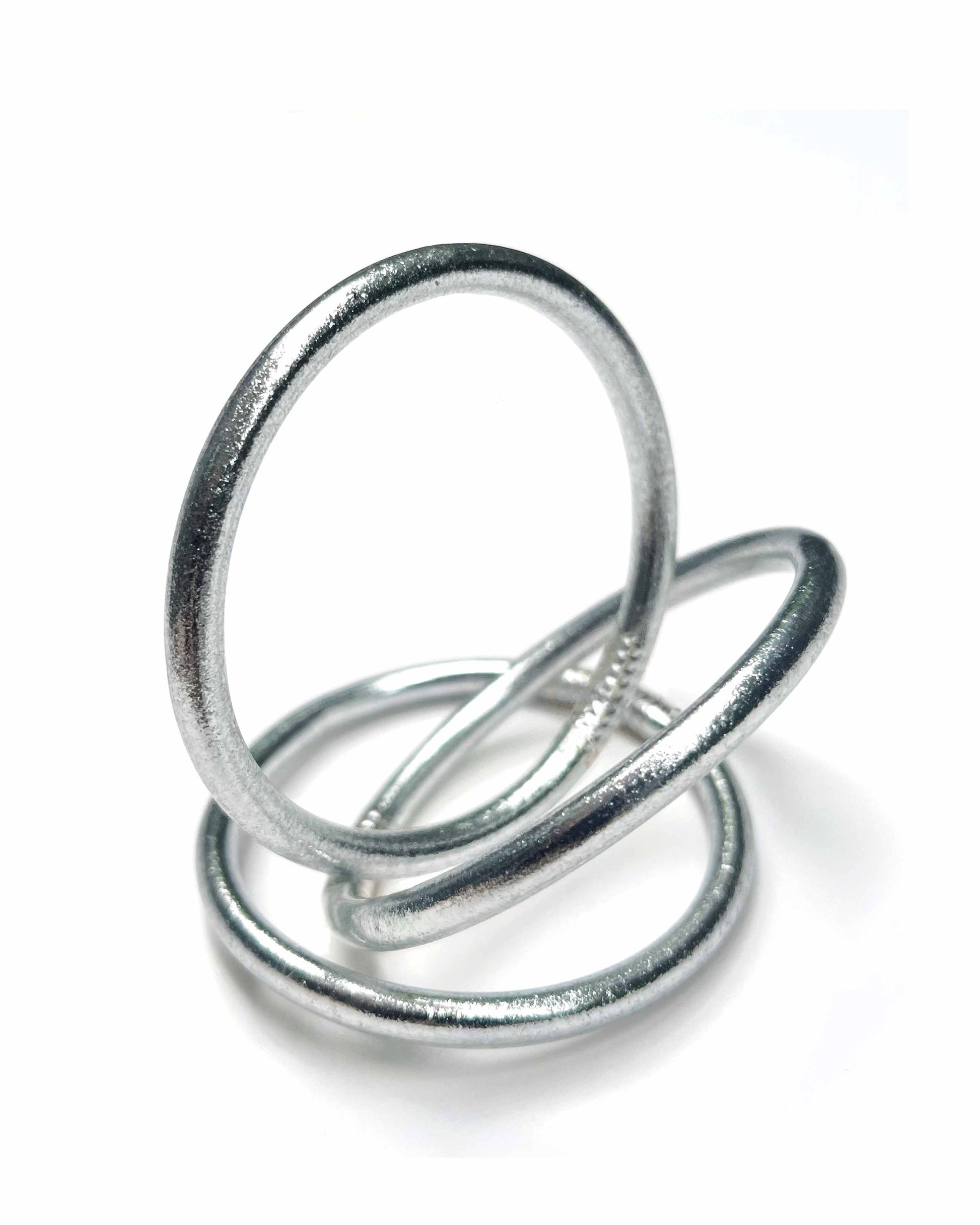 Chunky Kumlai Buddhist bangles in Classic Silver on a white background.