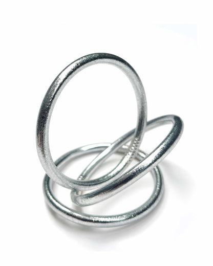 Chunky Kumlai Buddhist bangles in Classic Silver on a white background.