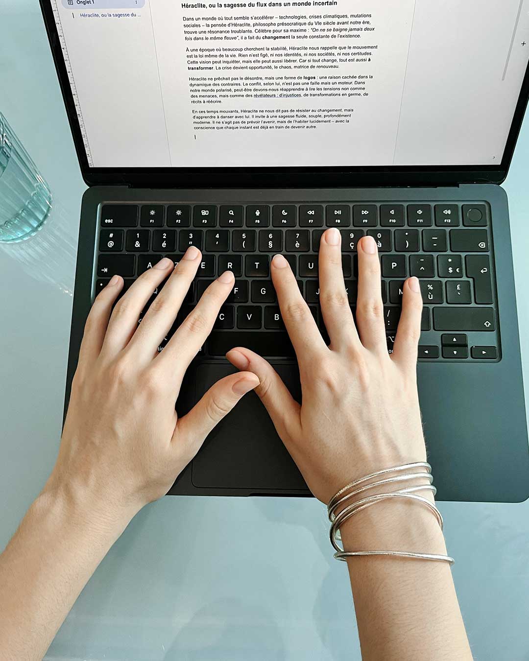 Thin Kumlai Buddhist bangles in Rose Silver, worn at the office.