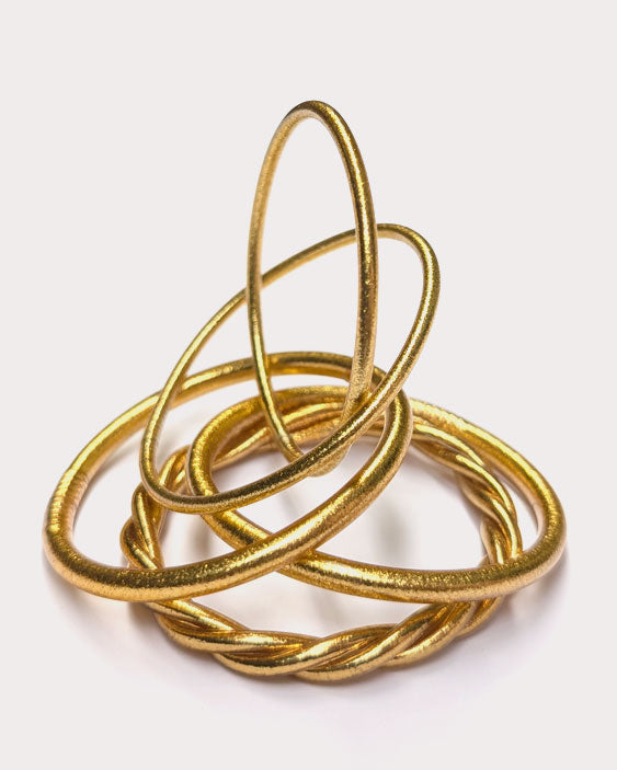 Kumlai Buddhist bangles in classic gold, our bestsellers.