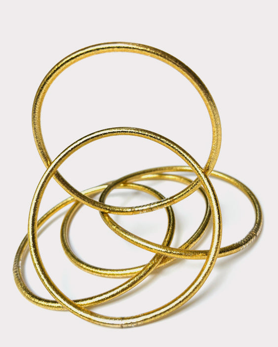 Five thin Classic Gold Kumlais on a white background, our bestseller.