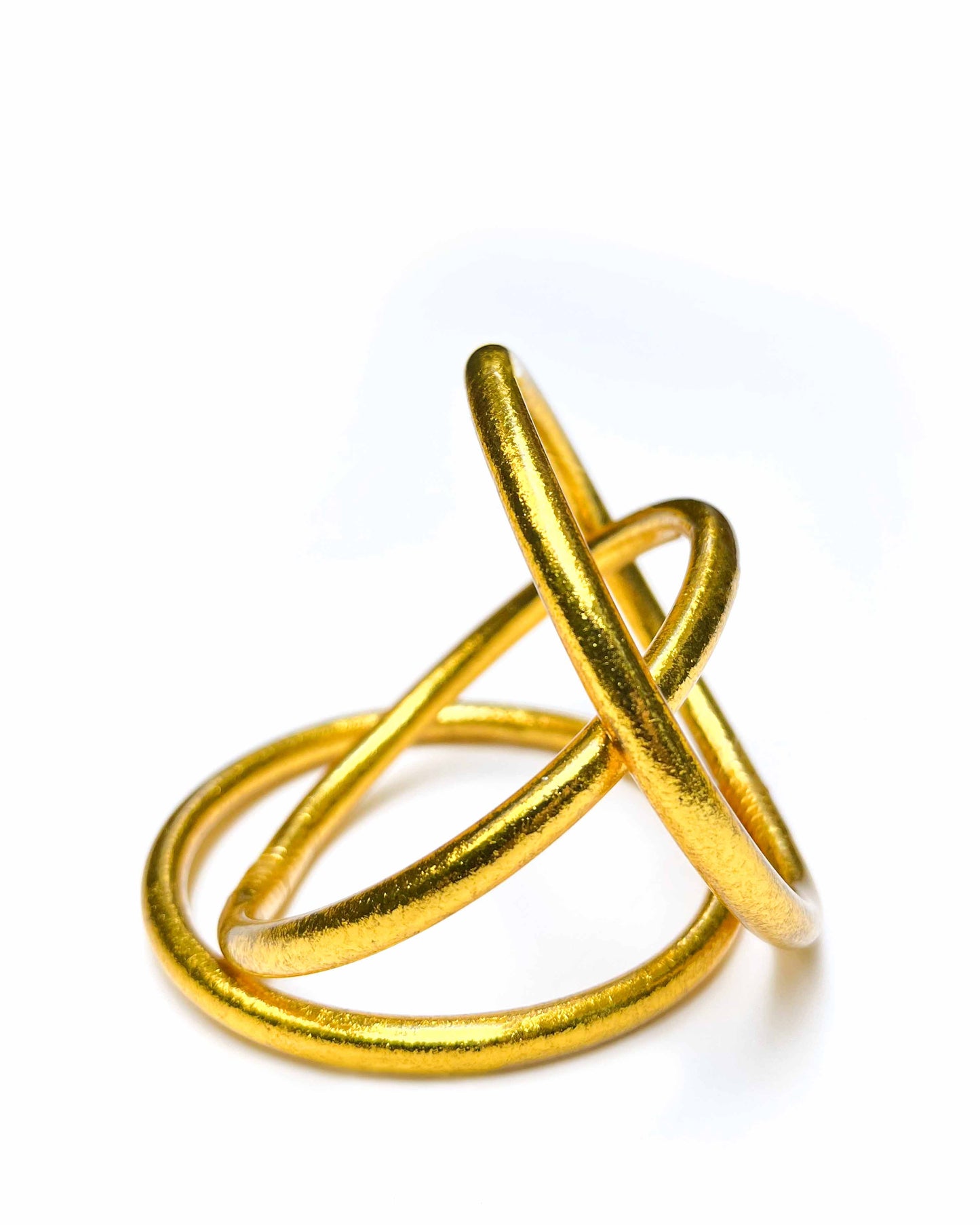 Chunky Kumlai Buddhist bangles in Rich Gold on a white background.